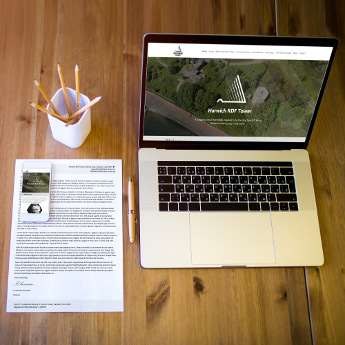A mockup of a website and graphic design work